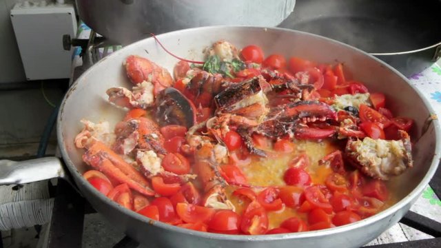 preparation of Lobster with tomatoes in a pan for Italian pasta