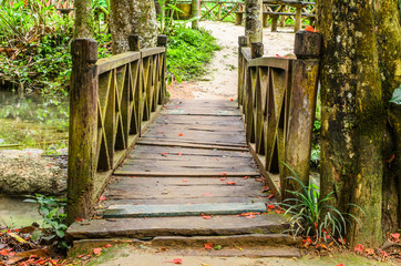 wooden bridge across stream