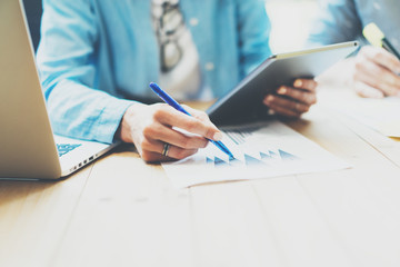 Photo Sales Manager Working Modern Office.Woman Use Generic Design Tablet,Holding Pencil Hand.Account Department Work process New Startup project.Wood Table.Horizontal.Blurred Background.Film effect.