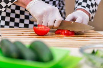 Male cook preparing food in the kitchen