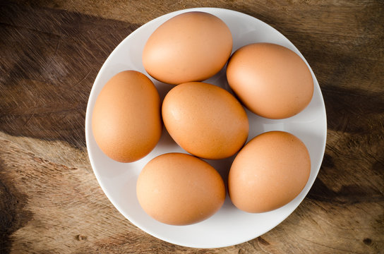 Eggs on wooden background,food ingredient