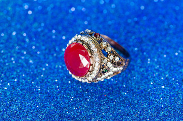 Jewellery ring against blue background