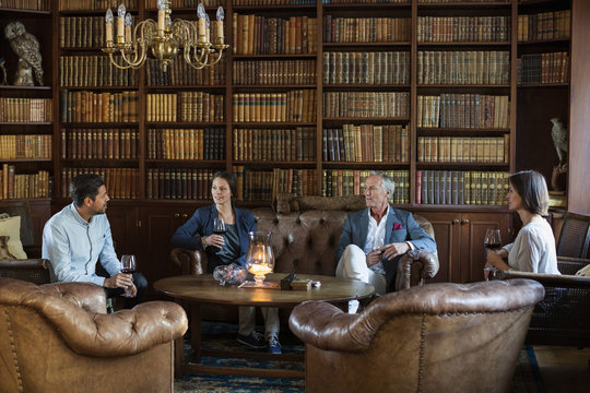 People sitting and talking in old library 