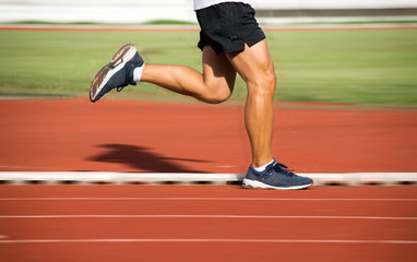 Man Running on track at Sport Stadium