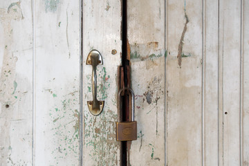 Close up Old white door and master key lock