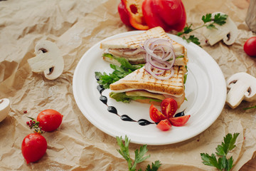 Sandwiches on parchment background with vegetable composition
