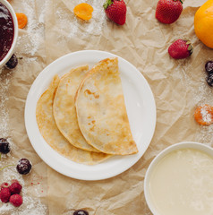 Pancakes with jam and berries. Flat Lay, square crop