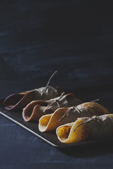Chocolate pancakes on rusty tinwere on scratched blackboard