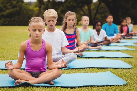 Front view of children doing yoga 