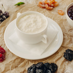 Rice porrige with berries on parchment background