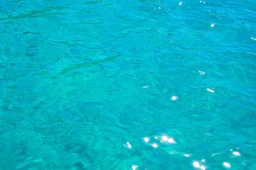Background of clear azure sea water top view