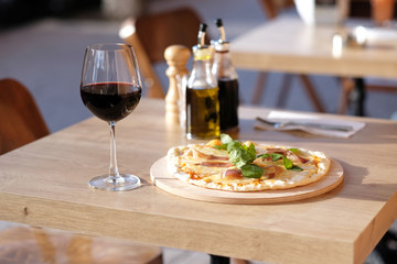 Pizza and red wine in restaurant
