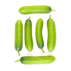 Fresh mini cucumbers isolated on white background
