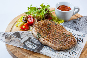 pork steak with salad and sauce