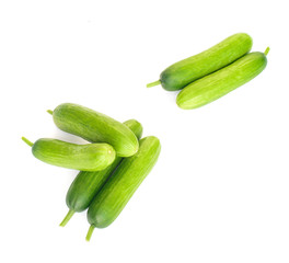 Fresh mini cucumbers isolated on white background