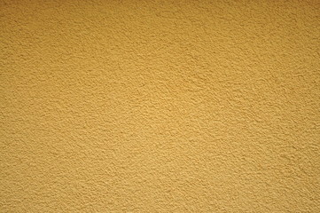 Yellow homogen wall texture and background