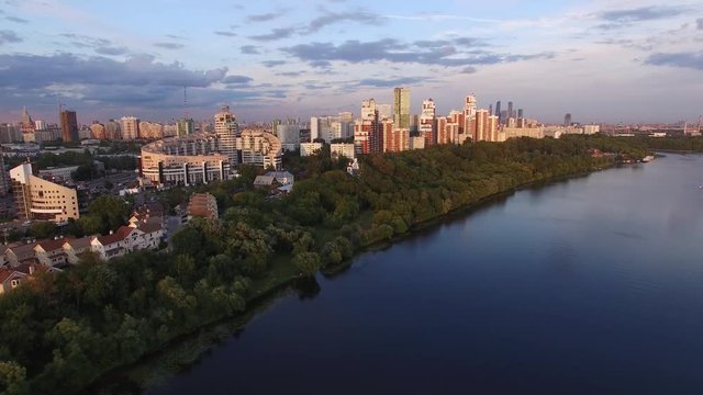 Moscow city rich residential aria apartment buildings. Flight over Moscow river. Beautiful aerial view. 