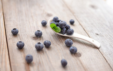 Fresh blueberry on wooden background