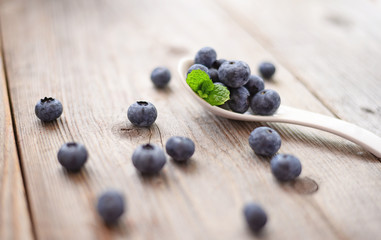 Fresh blueberry on wooden background