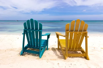 Papier Peint photo Plage de Seven Mile, Grand Cayman colorful chairs on caribbean coast