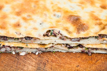 cutting bean filled bread (Lobiani) close up