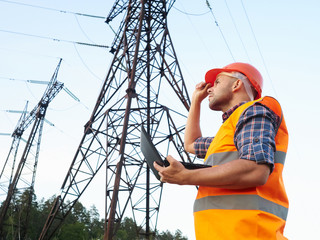 Electrical engineer working. Talking on the phone and working wo - 113347022