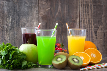 Fresh fruit smoothies on a rustic wooden background

