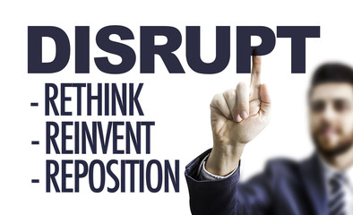 Business man pointing the text: Disrupt