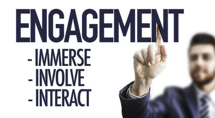 Business man pointing the text: Engagement