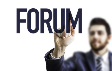 Business man pointing the word: Forum