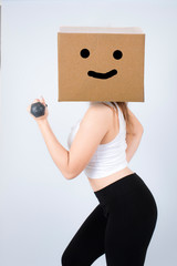Happy face box woman with dumbbells workout in fitness gym isola