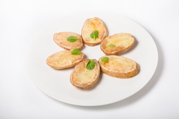 Obraz na płótnie Canvas Baked potato sliced on a plate