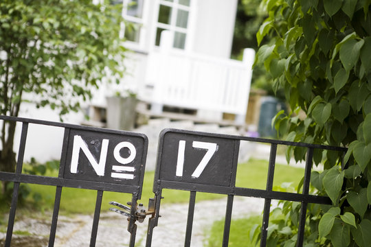 House number 17 on closed metal gate
