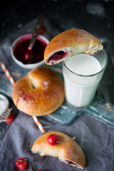 Bagels with cherry jam and milk
