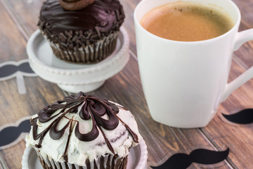 Delicious creative chocolate cupcake and cup of coffee for Fathers Day.