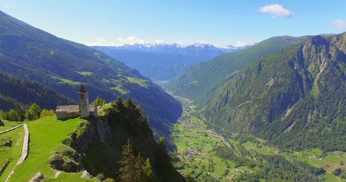 Aerial 4k - Chiesetta di San Romerio (1106) - Valle di Poschiavo - Canton Grigioni - Svizzera 