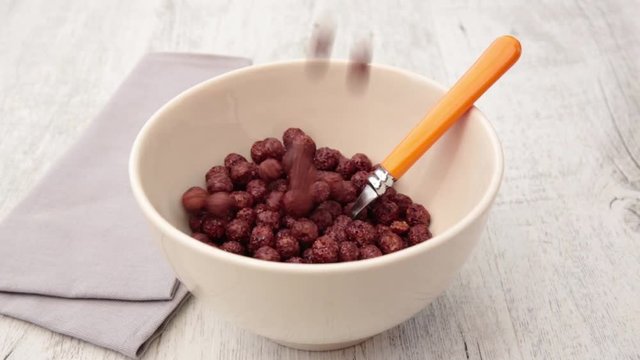 chocolate cereal ball pour in bowl