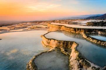 Carbonate travertines the natural pools during sunset, Pamukkale