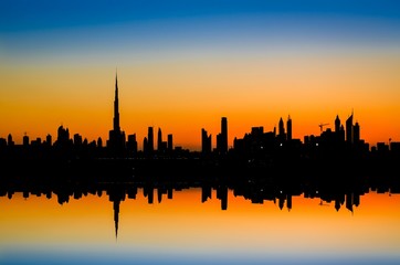 High rise buildings during stunning sunset in Dubai, UAE. 