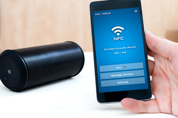 Using NFC application on smartphone to connect with wireless audio device