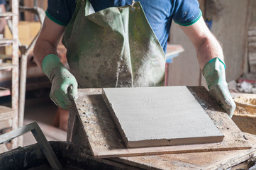 Just squared tiles made of clay and lavic sand ready to be fired