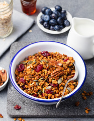 Healthy breakfast. Fresh granola, muesli with pumpkin,pecan nuts,cranberries and maple syrup
