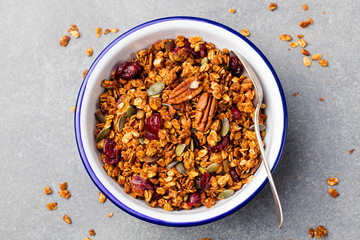Healthy breakfast. Fresh granola, muesli with pumpkin, pecan nuts, cranberries and maple syrup