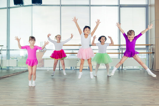 happy children dancing on in hall, healthy life, kid's togetherness and happiness concept