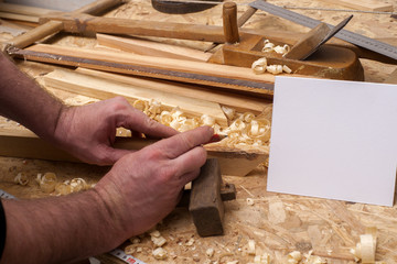 Carpenter working. Carpenter tools on wooden table with sawdust. Carpenter workplace top view. Copy space for text.