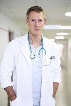 Portrait of male doctor standing in hospital