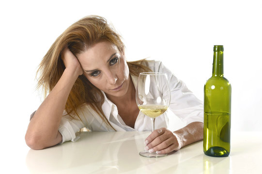 blond wasted and depressed alcoholic woman drinking white wine g