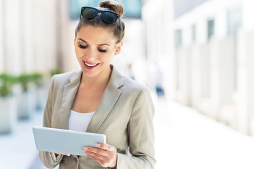 Attractive young woman using digital tablet
