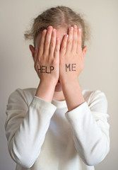 Fototapeta premium Child need help. Little girl crying.