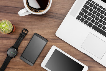 Responsive web designer desk with tablet, smartphone, MacBook, coffe and watch